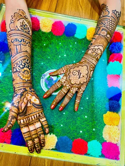 This design combines a personalized initial on one hand with traditional architectural and floral patterns on the other, offering a mix of modern and classic styles.