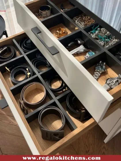 This drawer is an organizer's dream. We created custom-sized compartments for belts, watches, and jewelry, ensuring everything has its own designated and protected space.