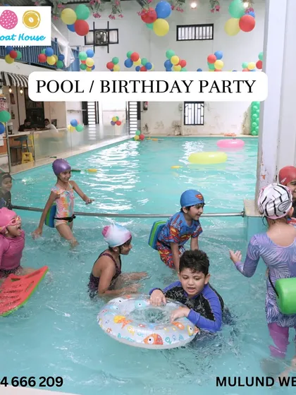 A group of kids enjoying a pool party, using kickboards and floats in our safe, indoor environment.