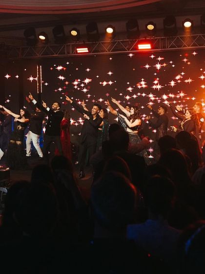 A grand finale shot from a Roka night in Mumbai, with the couple and all their friends on stage.