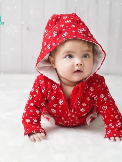 All ready for winter in her festive red hooded outfit. We love capturing individual portraits of each twin to highlight their unique expressions.