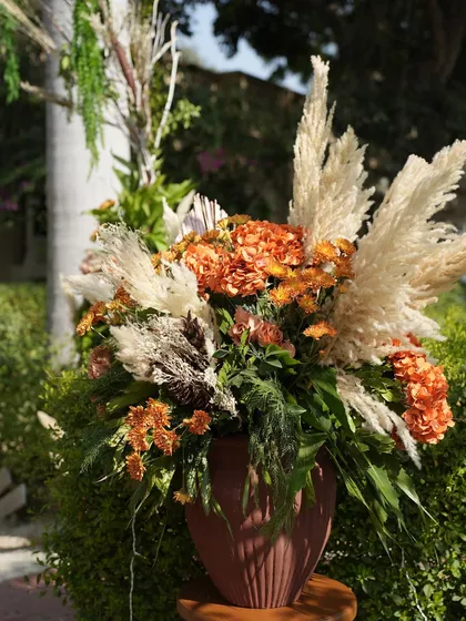Another beautiful rustic floral arrangement, combining dried pampas grass with orange marigolds. I use these arrangements to add texture and warmth to the decor.