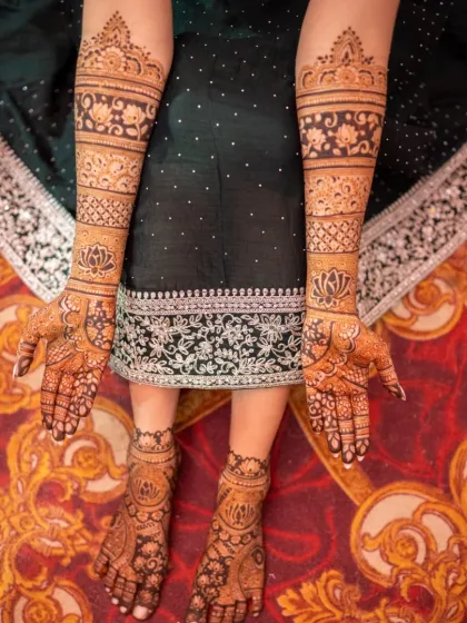 A complete bridal mehendi look, showing the coordination between the intricate designs on the hands and the equally detailed patterns on the feet.