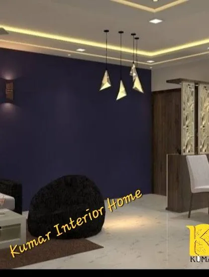 A bold living room design with a deep purple accent wall. The geometric pendant lights and minimalist furniture create a modern and dramatic effect.