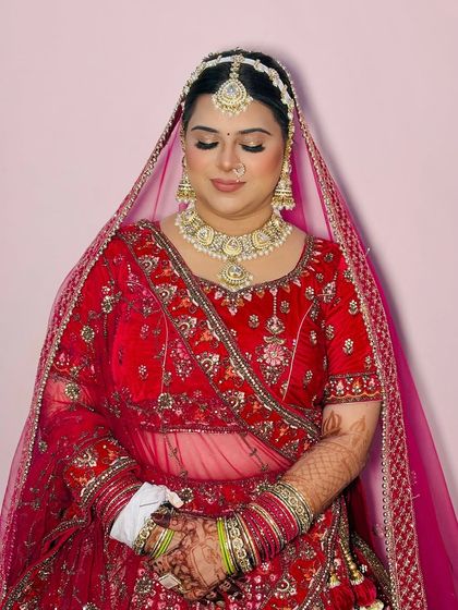 A close-up shot with eyes closed, focusing on the smooth application of the eyeshadow and foundation.