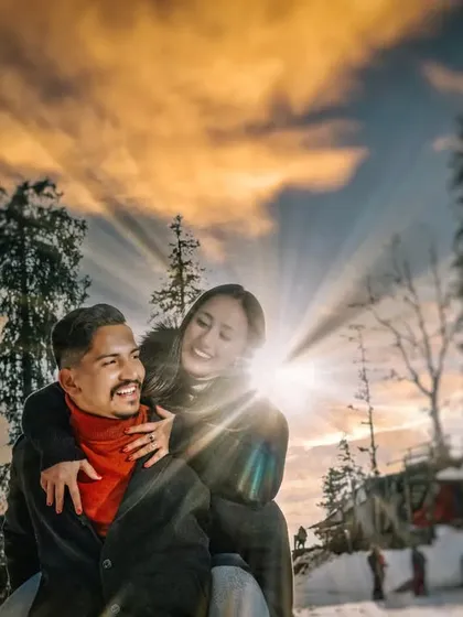 A fun and candid moment from a pre-wedding shoot in the snow. Capturing your genuine laughter and playful interactions is just as important as the posed, epic shots.