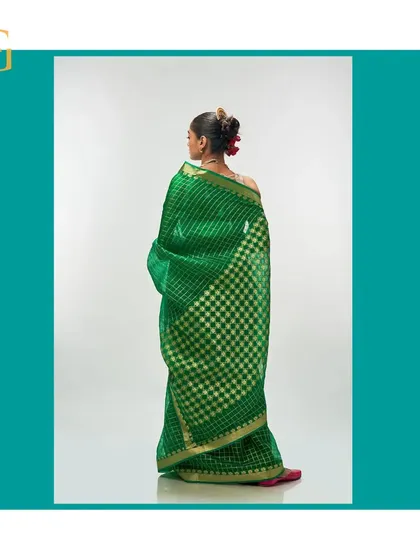 The back of the shamrock green saree, showing how the gold zari checks create a stunning visual effect.