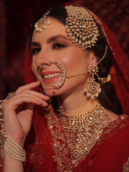 A smiling portrait of the bride, radiating happiness and looking flawless on her big day.