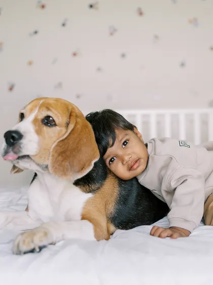 Our furry friends are part of the family too. This tender moment between a boy and his best friend shows that my sessions are for everyone you love, capturing the special bonds you share.