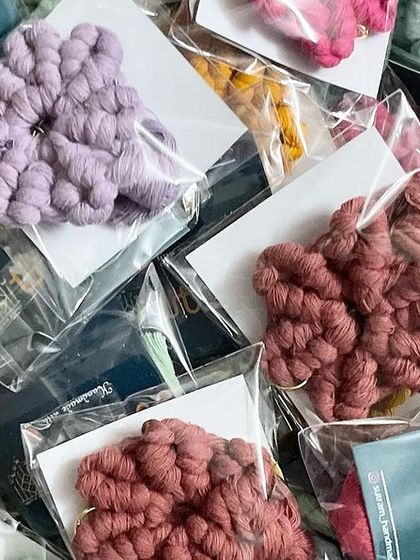 A basket full of my flower keychains. It's so satisfying to see a big order come together.