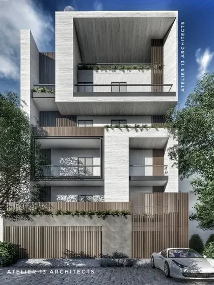 We craft bold, contemporary facades for urban residences. This design uses monolithic forms of white travertine stone to create deep, shaded balconies and a powerful vertical presence, offering a modern interpretation of texture and form in residential architecture.