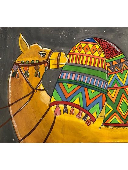 A close-up of a poster colour painting of a decorated camel. The intricate patterns and bright colours are a joy to look at.