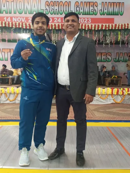 Another one of our champions with his coach at the National School Games. We are committed to guiding each athlete on their path to the podium.