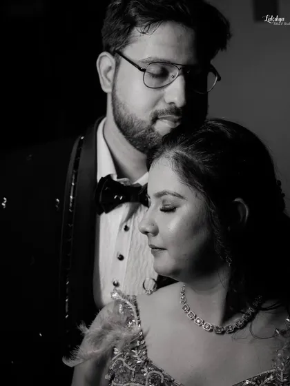 An intimate black and white close up portrait. This photo captures a quiet, tender moment, focusing purely on the couple's emotions.
