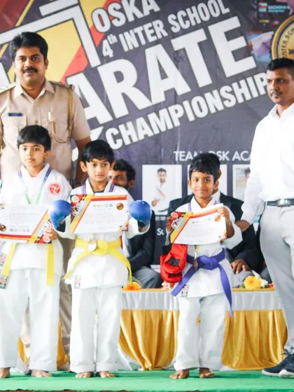Young winners proudly display their certificates and medals on stage. Our championships provide a platform for students to shine and be recognized for their skills.