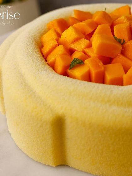 A close-up of the La Mangue Royale, showcasing the generous filling of fresh, diced mangoes.