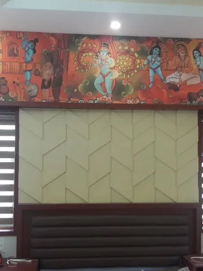 This bedroom features a unique combination of a traditional Indian mural above the headboard and modern 3D wall panels below. It's a creative way to blend cultural art with contemporary design.
