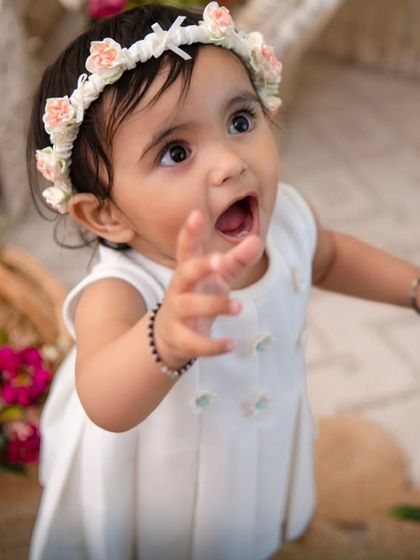 Reaching out with wonder. This candid shot captures the baby's curiosity and interaction with the beautiful boho environment I create.