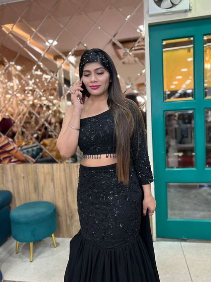 Another candid shot, highlighting the sleekness of the hair and the flawless makeup application.