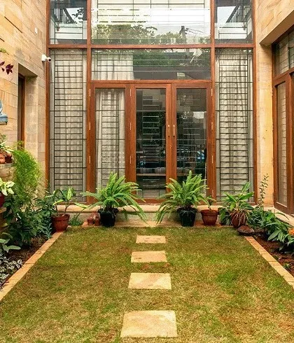 We designed this internal courtyard for the Chatty Residence to act as the green heart of the home. The space is lined with sandstone and filled with plants, providing a tranquil view and improving natural ventilation for the surrounding rooms.