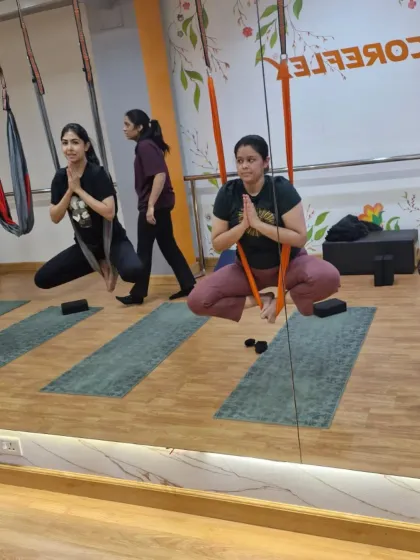A moment of calm and focus in our aerial class. Using the hammock as a seat, we practice grounding and centering poses that prepare the mind and body for more dynamic movements.