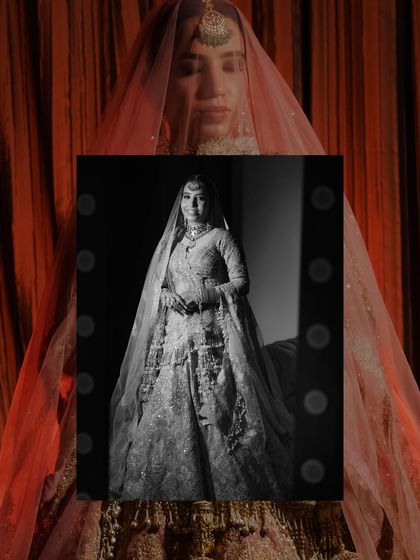 An artistic bridal portrait with a double-exposure effect. A black and white image of the bride in a mirror is overlaid on a color photo, creating a moody and introspective feel.