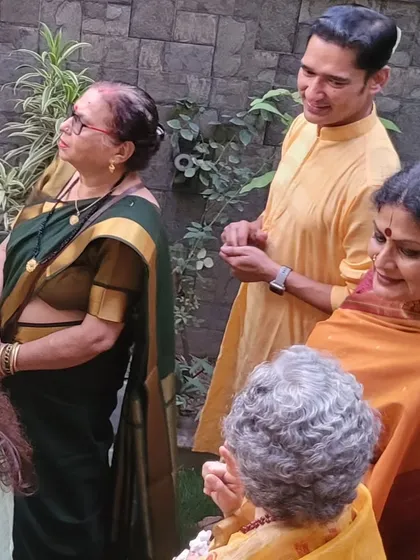 Sharing a moment with my student's family during the ceremony. The guru-shishya bond extends to the entire family, creating a beautiful community.