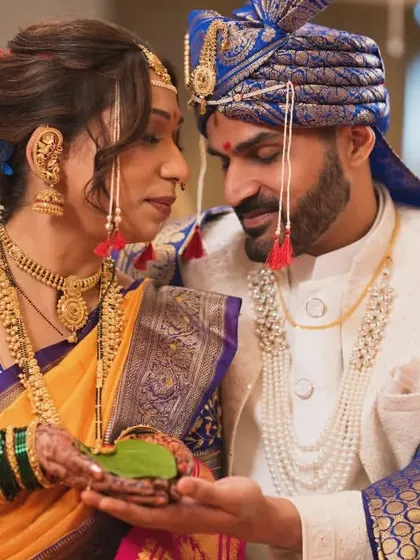 A traditional Maharashtrian wedding ritual involving a betel leaf, captured with reverence and detail.