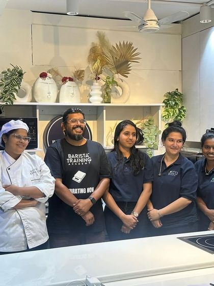 A group photo with the talented team at Just Appetite after a successful coffee appreciation workshop.