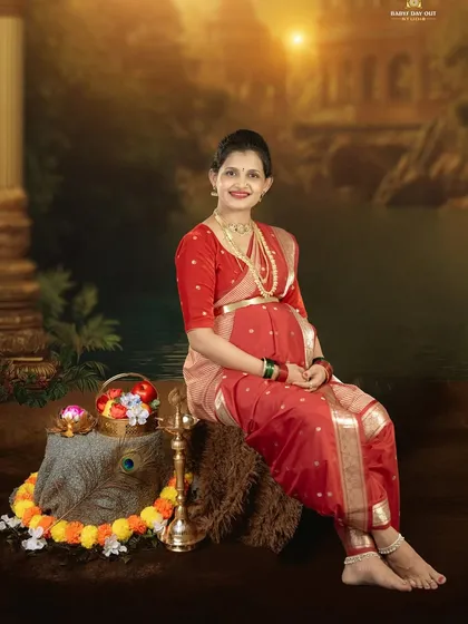 Embracing tradition with grace and beauty. This is a classic studio portrait of a mother-to-be in a traditional Maharashtrian-style saree, showcasing the timeless elegance of our cultural heritage.