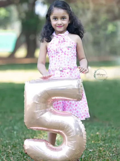 A confident smile for her fifth birthday. As children grow, their personalities blossom, and I love capturing that spirit in my kids' portrait sessions.