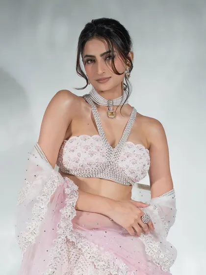 A close-up from the Times Fashion Week shoot, focusing on the intricate details of the jewelry and the couture top.
