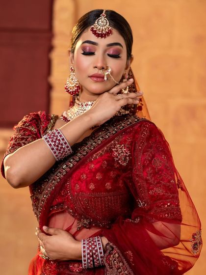 A beautiful pose with eyes closed, highlighting the rich pink and red eyeshadow.