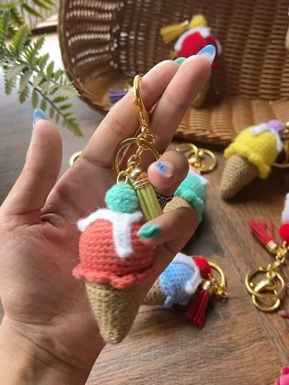 Our ice cream cone keychains are another sweet treat for your keys or bag. This one features a scoop of strawberry ice cream with white "syrup" and a cherry on top.