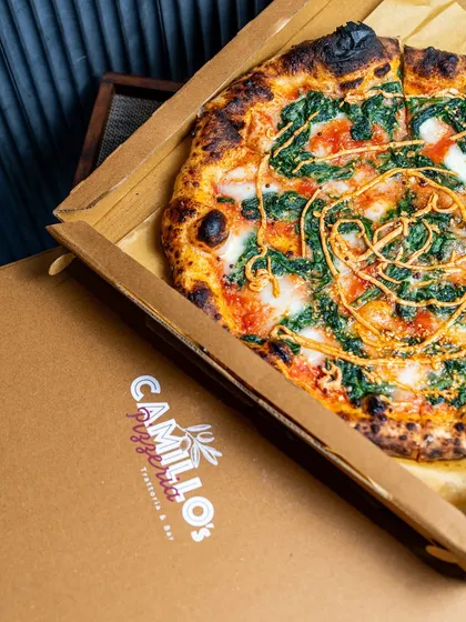 Sometimes the best seat in the house is your own sofa. I box up my pizzas straight from the oven, so you get that fresh, hot, and authentic trattoria experience delivered right to your door. This is comfort food, no fuss involved.