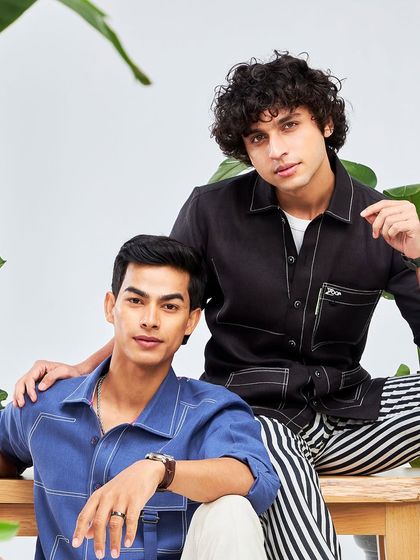 A group shot showcasing the versatile styles of the Antriksh collection. From contrast stitching to striped trousers, these pieces are designed for comfort and flair.