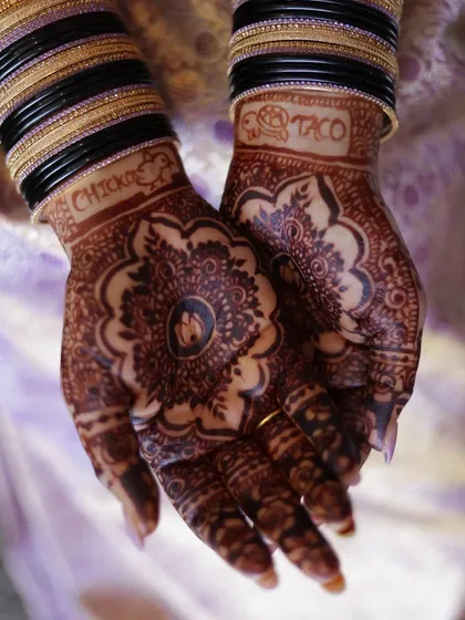 Your mehndi can be a canvas for your inside jokes and favorite things. For this bride, we included fun symbols of a turtle, a taco, and a chick, making her bridal henna a playful reflection of her personality.
