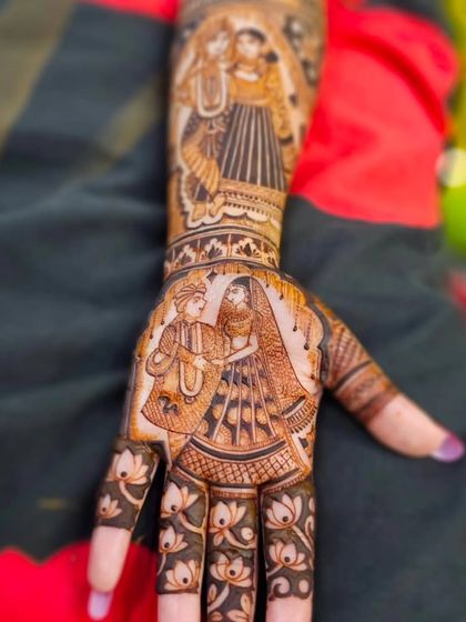 A close-up of a palm featuring a beautifully shaded portrait of a bride and groom during their wedding ceremony.