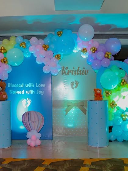 This main stage for Krishiv's naming ceremony was "blessed with love, named with joy." We used soft blue backdrops, pastel balloon arches, and cute teddy bears perched on pedestals to create a sweet and celebratory focal point.