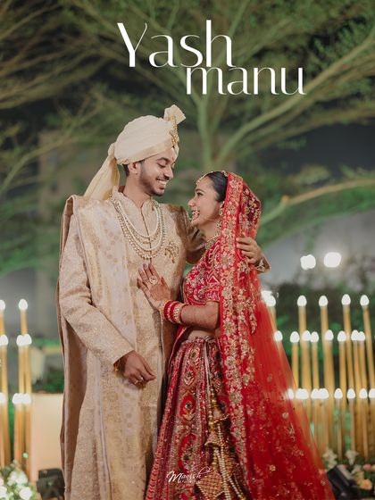 A beautiful night-time portrait of the Gujarati bride and groom, surrounded by the warm glow of candles, their smiles lighting up the frame.