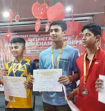 Our players proudly displaying their medals and certificates at the Delhi District Badminton Championships. This photo captures the successful outcome of their hard work.