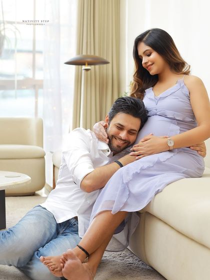 An intimate at-home session, capturing the husband-to-be listening to the baby's heartbeat. These moments, in the comfort of your own space, are truly precious.