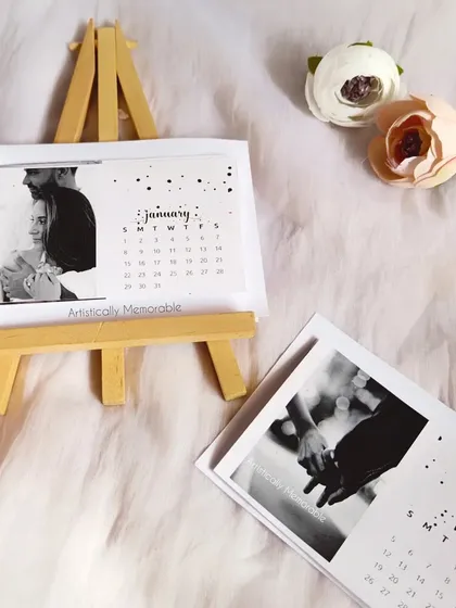 A black and white themed easel calendar, showing a romantic couple's photo for January. A classic and timeless style.