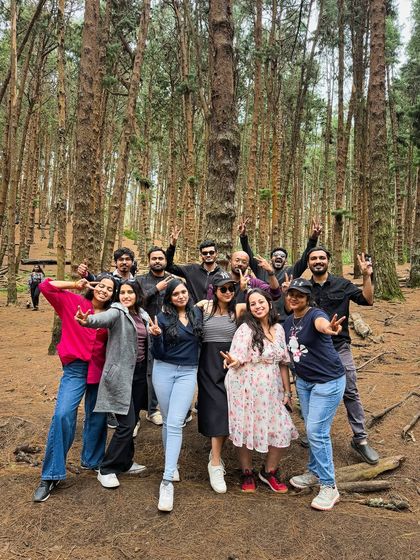 Our group having fun and posing for a photo in the middle of the dense pine forest in Kodaikanal.