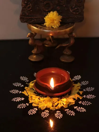 Happy Diwali from our family to yours. A simple diya, surrounded by a hand-block-printed rangoli, brings warmth and light to our studio.