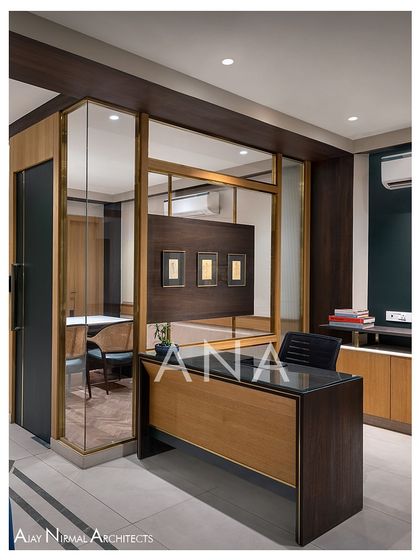 The reception area was designed to integrate the client's valuable artworks. The partitions themselves become frames, showcasing pieces both inside and outside the private rooms.