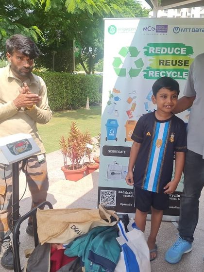 A father and son pose after dropping off their segregated waste at the RPS International School drive. We love seeing families participate together in building a greener future.