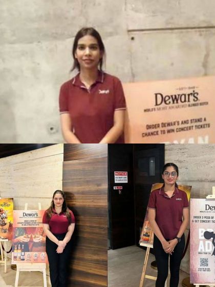 We celebrate the talented women on our team. Here, our female brand ambassadors are featured during a promotional event for Dewar's, showcasing their professionalism and contribution to our success.