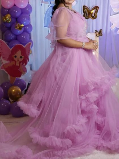 Feel like a queen with your little princess in this matching lavender ruffle gown. It's an ideal choice for a themed birthday party, and we ensure a perfect fit.