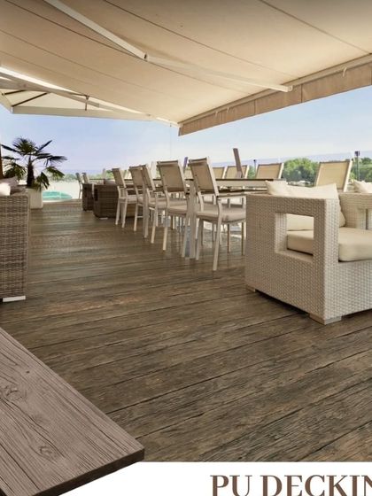 This is an example of PU decking used for a large restaurant patio. It can handle heavy foot traffic and furniture, making it perfect for commercial outdoor dining areas.